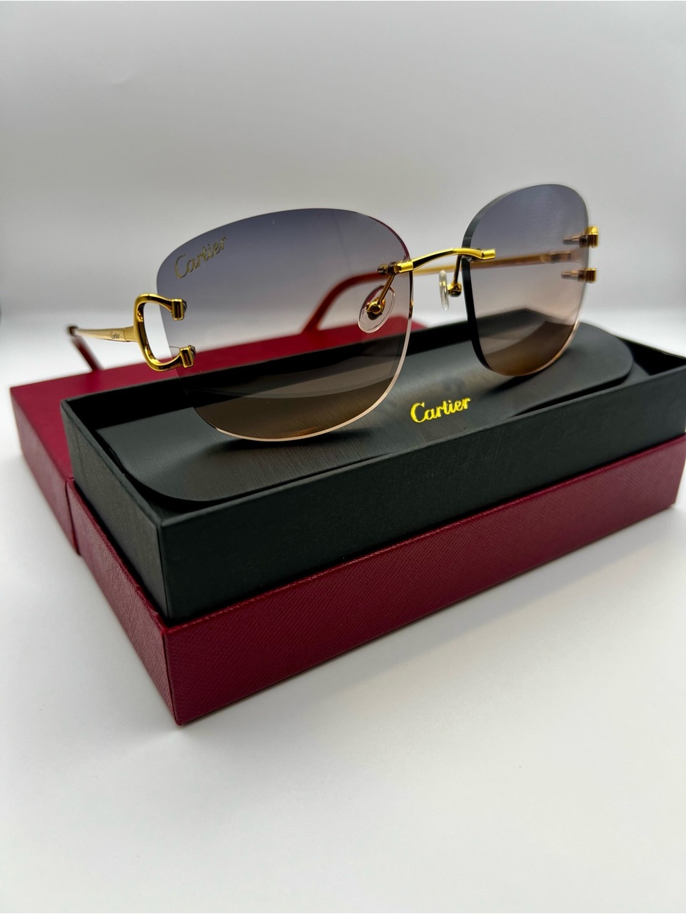 Cartier Gold Rimless Sunglasses with Brown-to-Gray Gradient Lenses